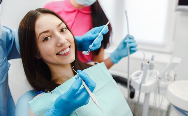 smiling woman in the dentist chair 1153 655 1 Duo Dental